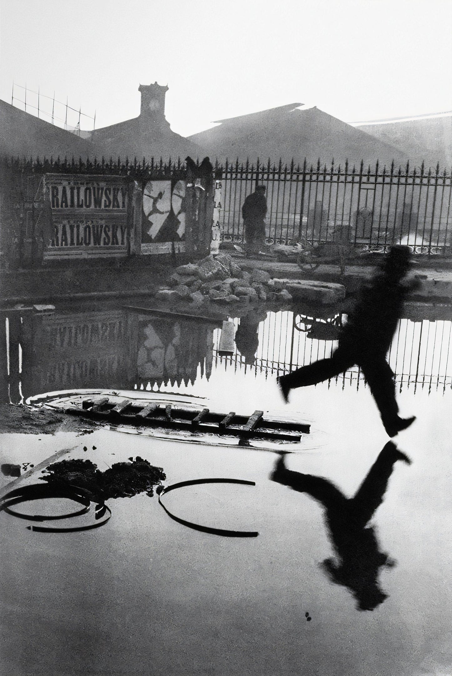 Man Leaping Over a Puddle - Henri Cartier-Bresson