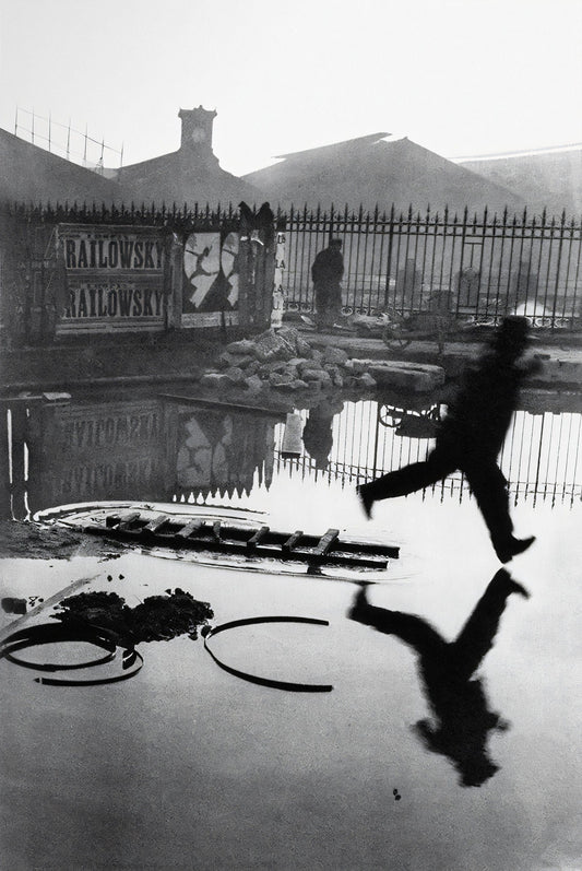 Man Leaping Over a Puddle - Henri Cartier-Bresson